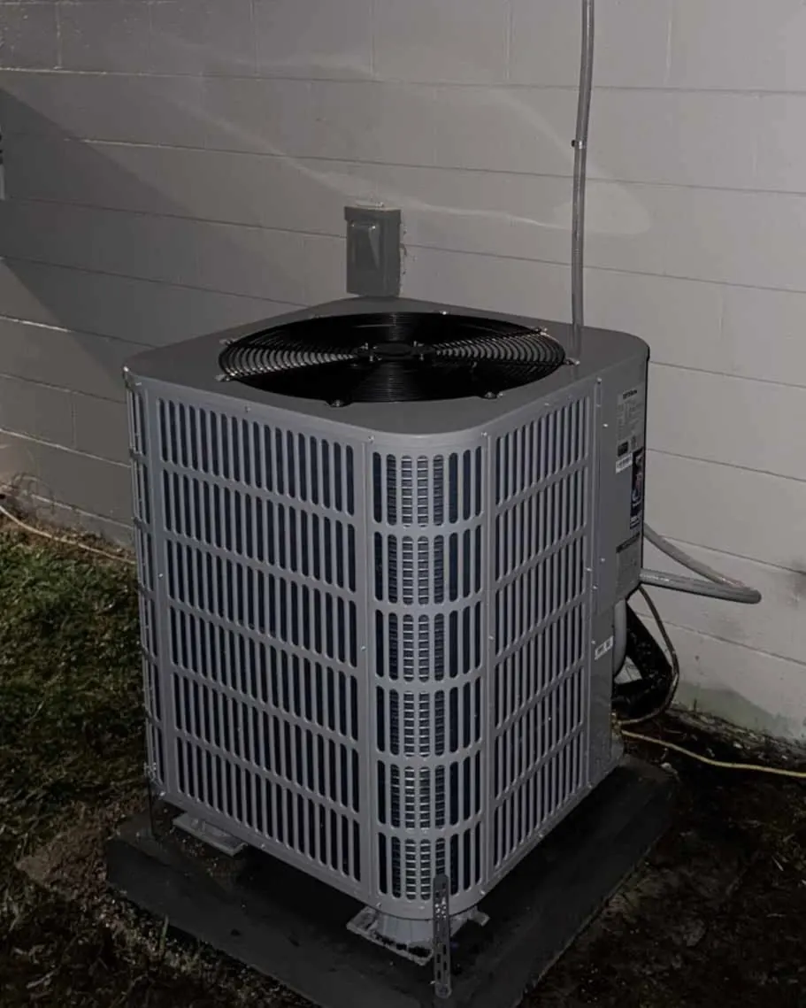 A brand-new air conditioning condenser installed by Launchpad Services